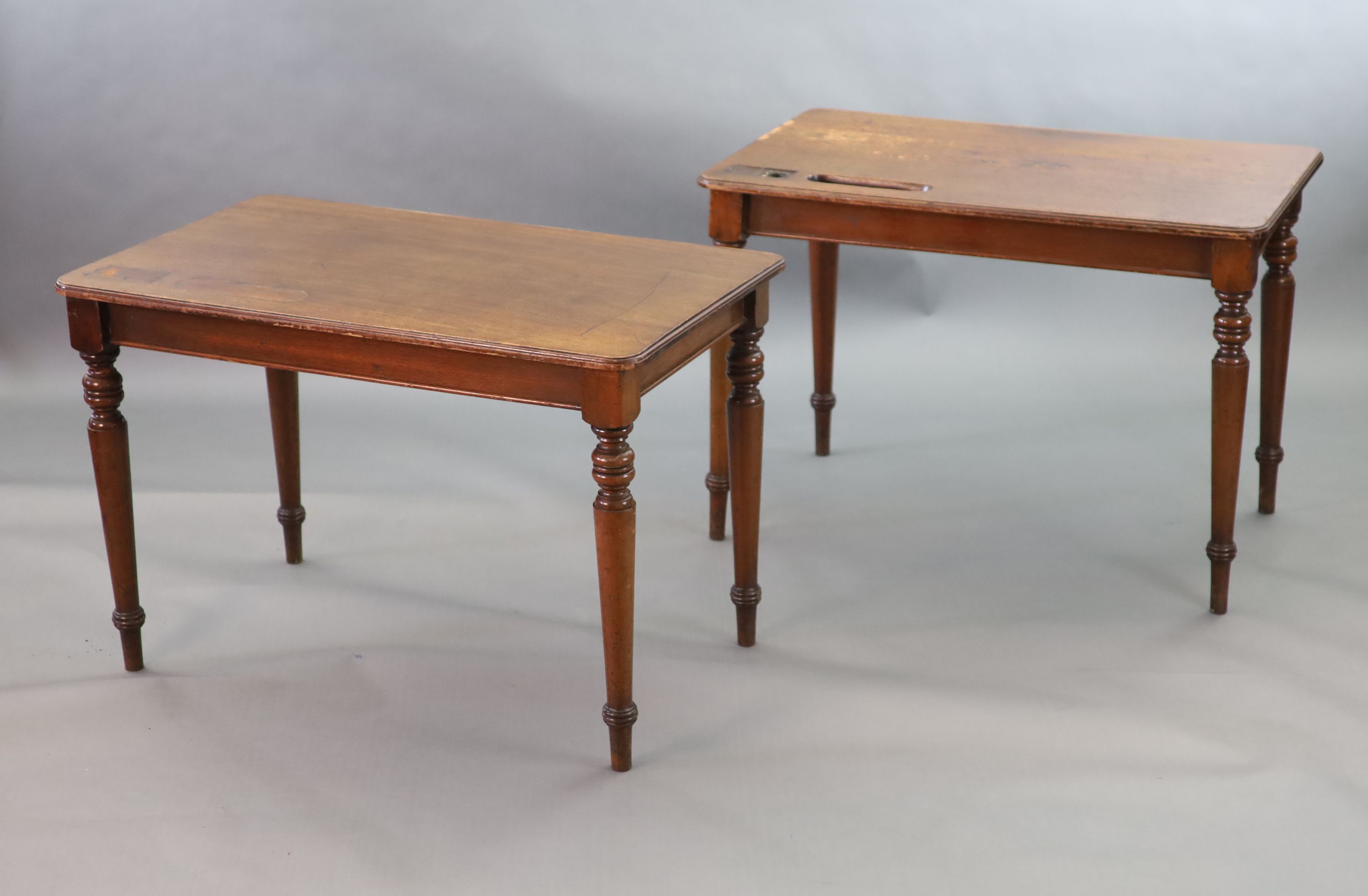 A pair of late Victorian mahogany writing tables, W.112cm D.68cm H.77.5cm